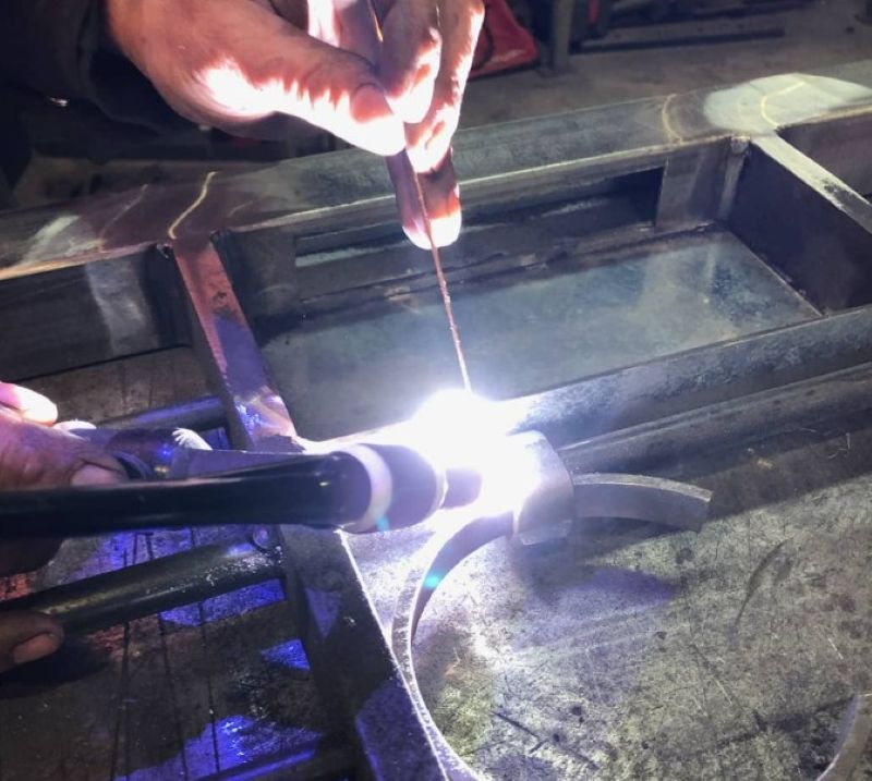 TIG welding a detailed piece in the POBOX workshop