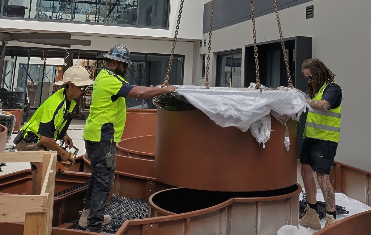 Large-format POBOX aluminium planters being installed in a public plaza